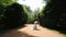 Full-length view of the happy gorgeous couple of newlyweds dancing in the beautiful garden.