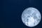 full milk moon back on silhouette antennas on the night sky