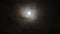 Full moon behind clouds at night. 4K UHD