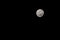 Full moon on a black cloudless sky. A natural satellite