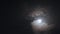 Full moon, bright clouds and moon halo is visible in night time photo shot in Delhi