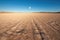 full moon casting long shadows on the desert sand