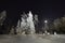 Full moon in clear sky shines over frozen Scandinavian wild forest, long exposure night photo, winter, virgin snowy landscape