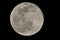 Full moon close up. Black night sky background. Planet satellite