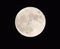 The full moon on a dark sky with the details and structure