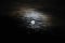 Full moon with dramatic clouds and lunar halo background