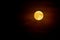 Full moon in the mist on dark night sky background