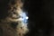 Full moon in a mysterious night sky with clouds and copy space