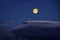 Full moon over parking airplane