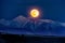 Full moon over peak in Tatras, Slovakia