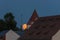 Full moon over the roofs and towers of Regensburg, Germany