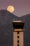 Full Moon Rises Over Air Traffic Control Tower and McDowell Mountain Range