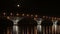 Full moon rises over the bridge. Time-lapse. Road bridge between the cities of Saratov and Engels, Russia. The Volga River