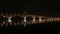 Full moon rises over the bridge. Time-lapse. Road bridge between the cities of Saratov and Engels, Russia. The Volga River