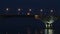 Full moon rises over the bridge. Time-lapse. Road bridge between the cities of Saratov and Engels, Russia. The Volga River