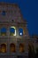 Full moon rising over the Colosseum or Roman Coliseum at dusk, originally the Flavian Amphitheatre, an elliptical amphitheatre in