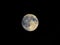 Full moon seen with telescope, starry sky
