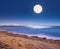 Full moon shining bright above the sea in Larnaca