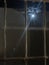 Full moon shining in night sky through old fashioned window