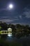 Full moon and Wooden waterfront pavilion