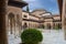 Full panoramic exterior view at the Patio at the Lions, twelve marble lions fountain on Palace of the Lions or Harem, Alhambra