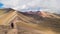 Full panoramic view of the rainbow mountain, many sand colors on the ground