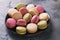 Full plate of various macaroons on the table