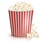 A full red-and-white striped bucket of fluffy popcorn.