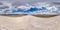 Full seamless spherical hdr panorama 360 degrees angle view on white sand gravel road among fields in spring day with awesome