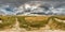 Full seamless spherical hdri panorama 360 degrees angle view on gravel road among fields in summer evening with awesome clouds in