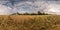 Full seamless spherical hdri panorama 360 degrees angle view among harvested rye and wheat fields with Hay bales in summer day