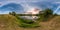 Full seamless spherical panorama 360 by 180 angle view on the shore of small lake in sunny summer evening with awesome clouds in
