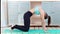 Full shot active fitness young woman making exercise cat cow posing practicing yoga