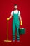 Full size fullbody portrait of handsome attractive housekeeper with stubble, hairstyle in green uniform, isolated on