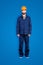 Full size fullbody portrait with legs of virile handsome repairer in blue uniform, isolated on grey background, looking