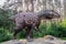 Full-size gigantosaurus statue in the forest of Belgorod dinopark. Carnivorous toothy predator