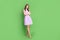 Full size half turn photo of cute smiling young slender girl lady folded hands confident tricky look model school banner