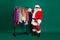 Full size photo amazed santa claus x-mas shopping assistant hold measure centimeter help choose buyer discount clothes
