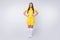 Full size photo of attractive sporty lady skilled player soccer women team arms by sides wear yellow football uniform
