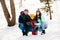 Full size photo of cheerful family happy positive smile mommy daddy daughter enjoy time together walk park