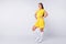 Full size photo of cool cheerful lady player soccer women team arms by sides wear yellow football uniform yellow t-shirt