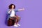 Full size photo of cool nice girl valise hitch hiking empty space wear denim shirt isolated on violet color background