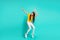 Full size photo of cool positive kid girl dancing isolated over teal color background