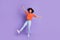 Full size photo of cute energetic delighted girl dancing spend free time summer vacation isolated on purple color