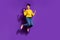 Full size photo of delighted nice person raise fists celebrate success jump isolated on violet color background