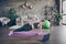 Full size photo of focused athlete energy girl watch laptop yoga regime video doing plank arms stretching exercise on