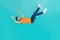 Full size photo of frightened guy falling downward by accident isolated on cyan color background