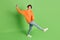 Full size photo of funky crazy young woman dance carefree good mood isolated on green color background