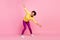 Full size photo of funky millennial brunette lady dance wear shirt jeans shoes isolated on pink background