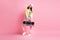 Full size photo of funky pretty girl hold boombox wear cap jacket trousers sneakers isolated on pastel pink color